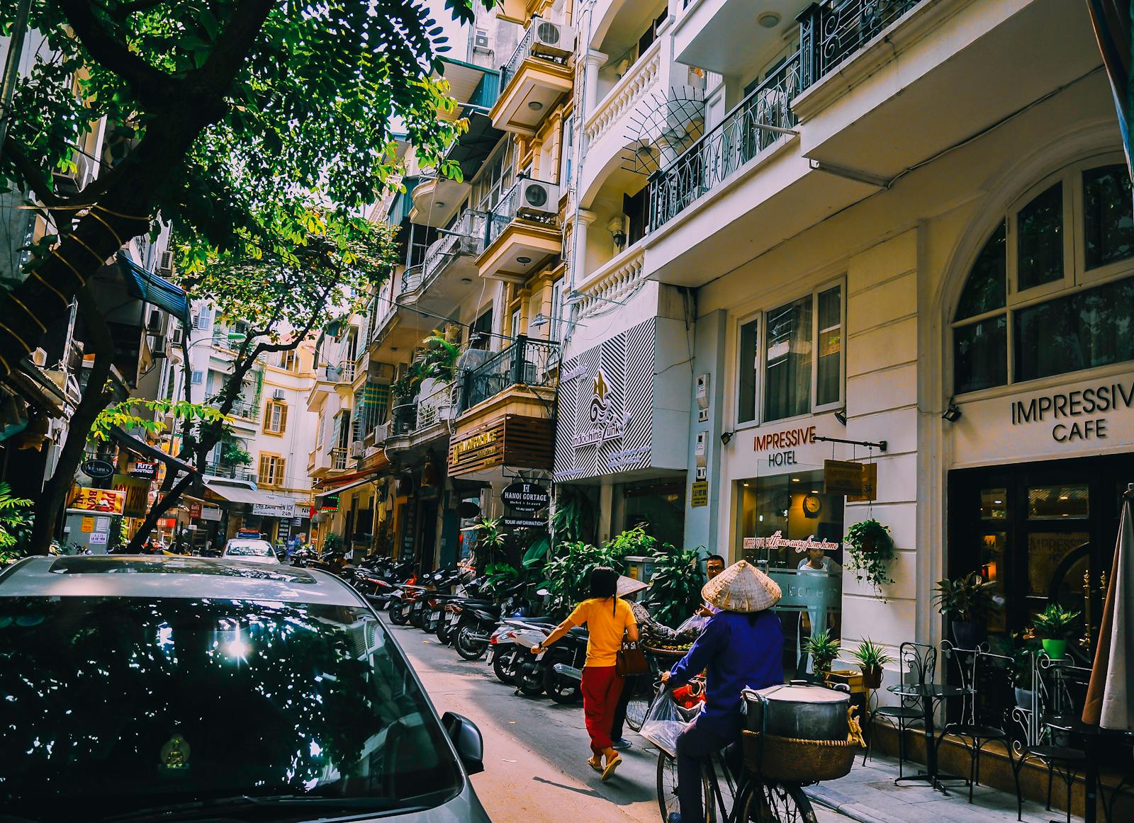 Photo by Arnie Chou People Walking in Front of Buildings